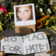 A makeshift memorial of flowers and a photo of the victim, Heather Heyer, sits in Charlottesville, Va., on, Aug. 13, 2017. (Steve Helber/(AP Images)